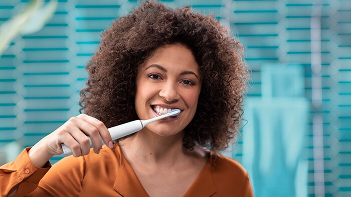 Woman brushing teeth