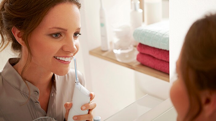 Woman flossing