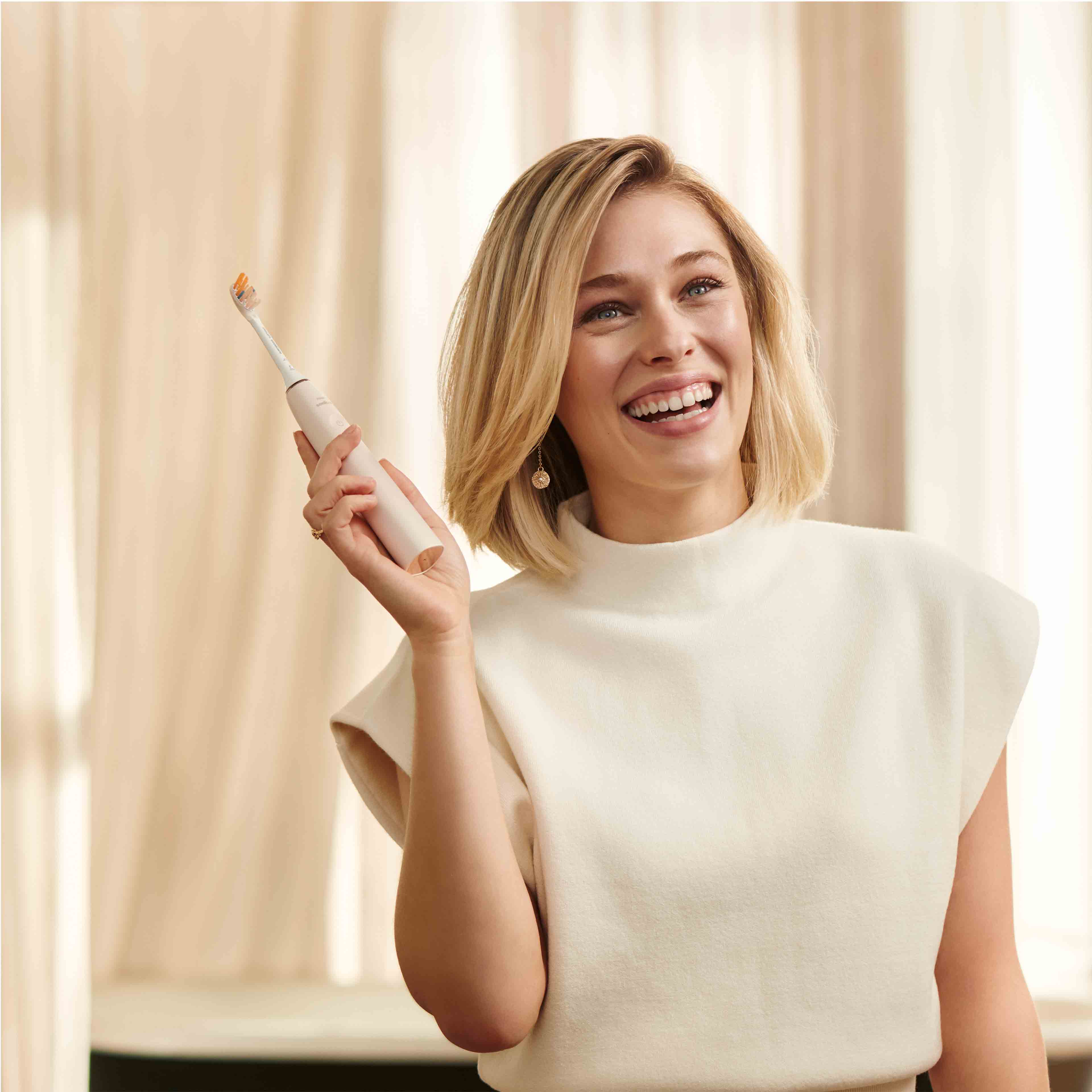 Woman smiling with toothbrush